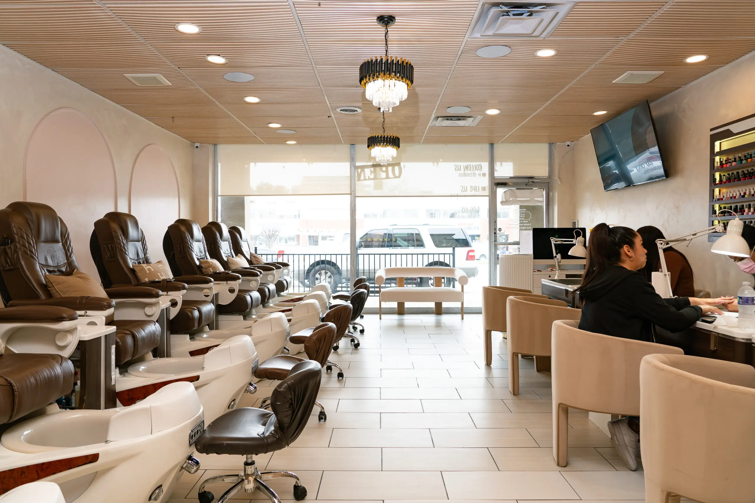 Spacious treatment lounge and natural light interior at ELITE NAIL BAR AND SPA on Lemmon Avenue