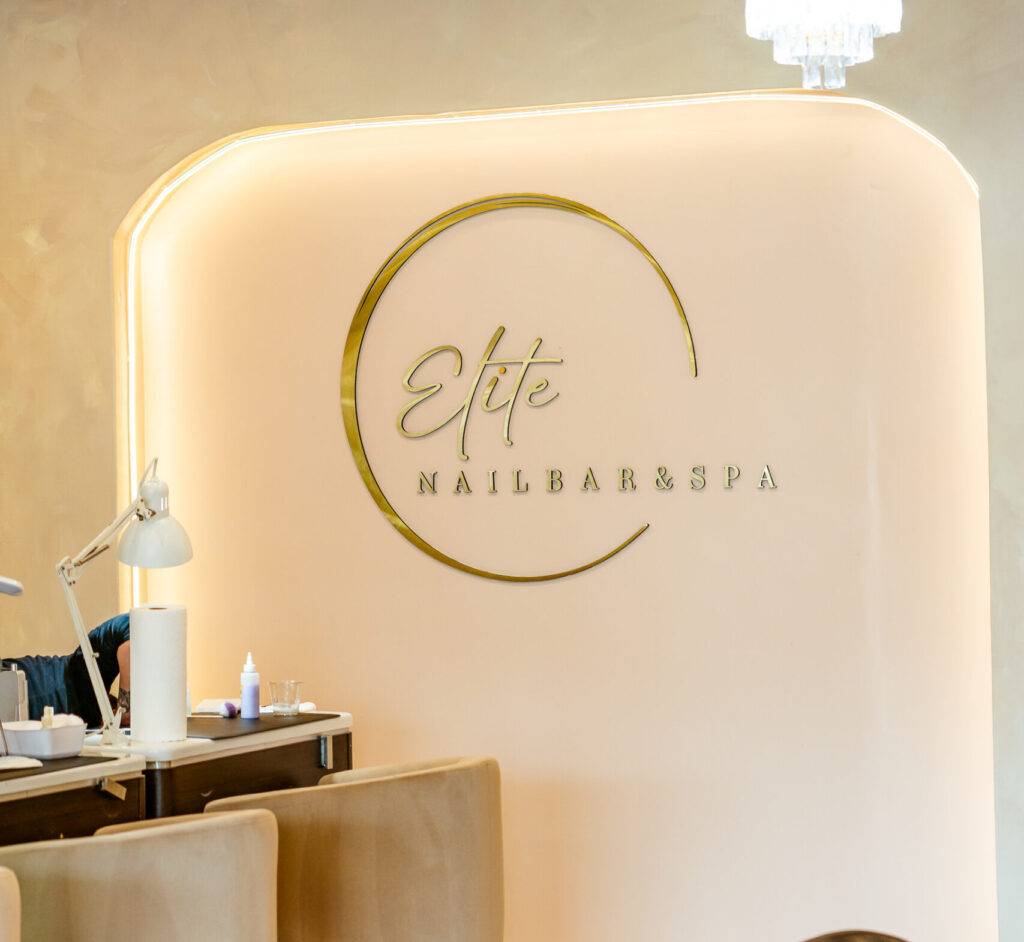 Guest enjoying attentive nail care and soothing warm towels at ELITE NAIL BAR AND SPA