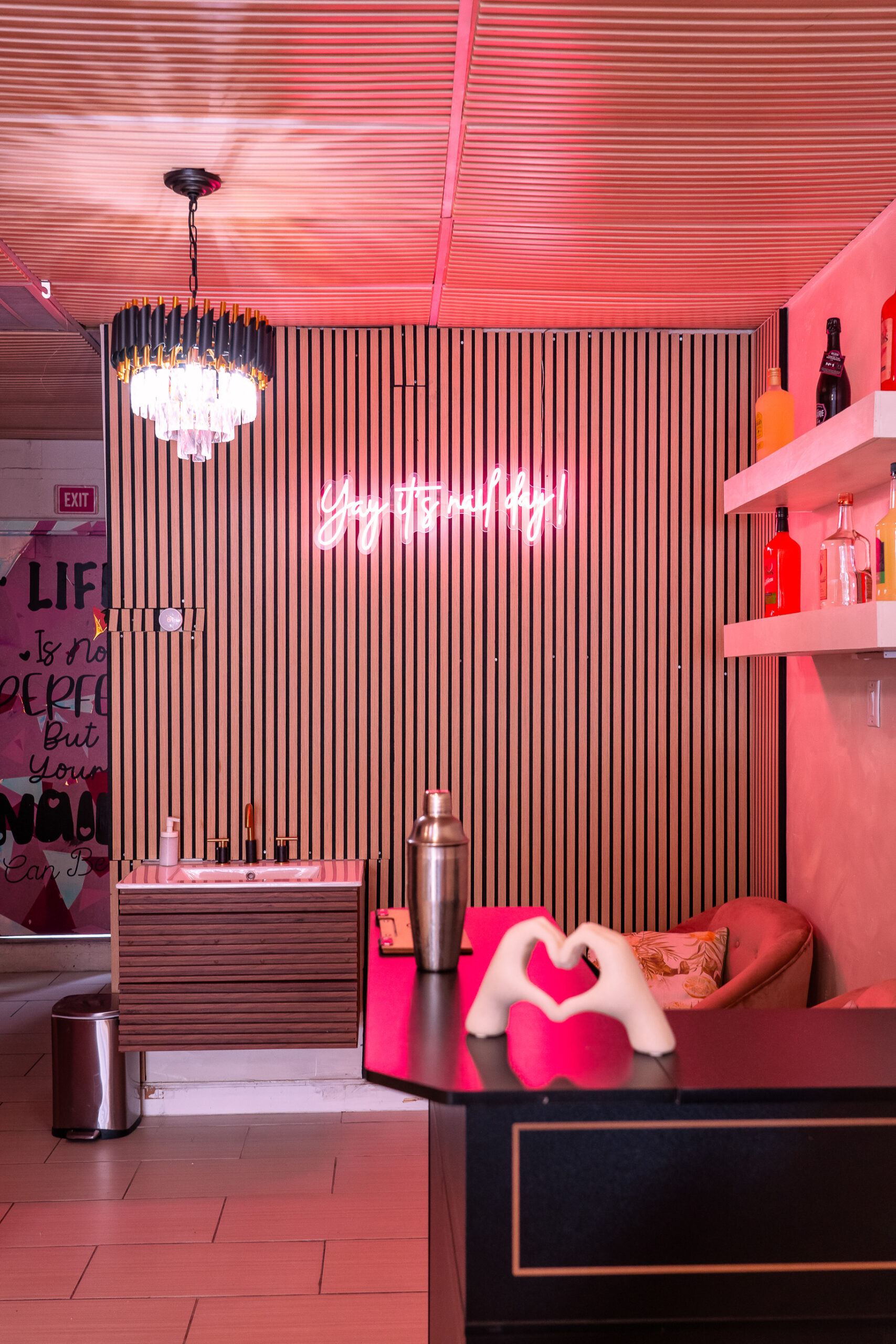 Modern check-in counter and complimentary drink station at ELITE NAIL BAR AND SPA
